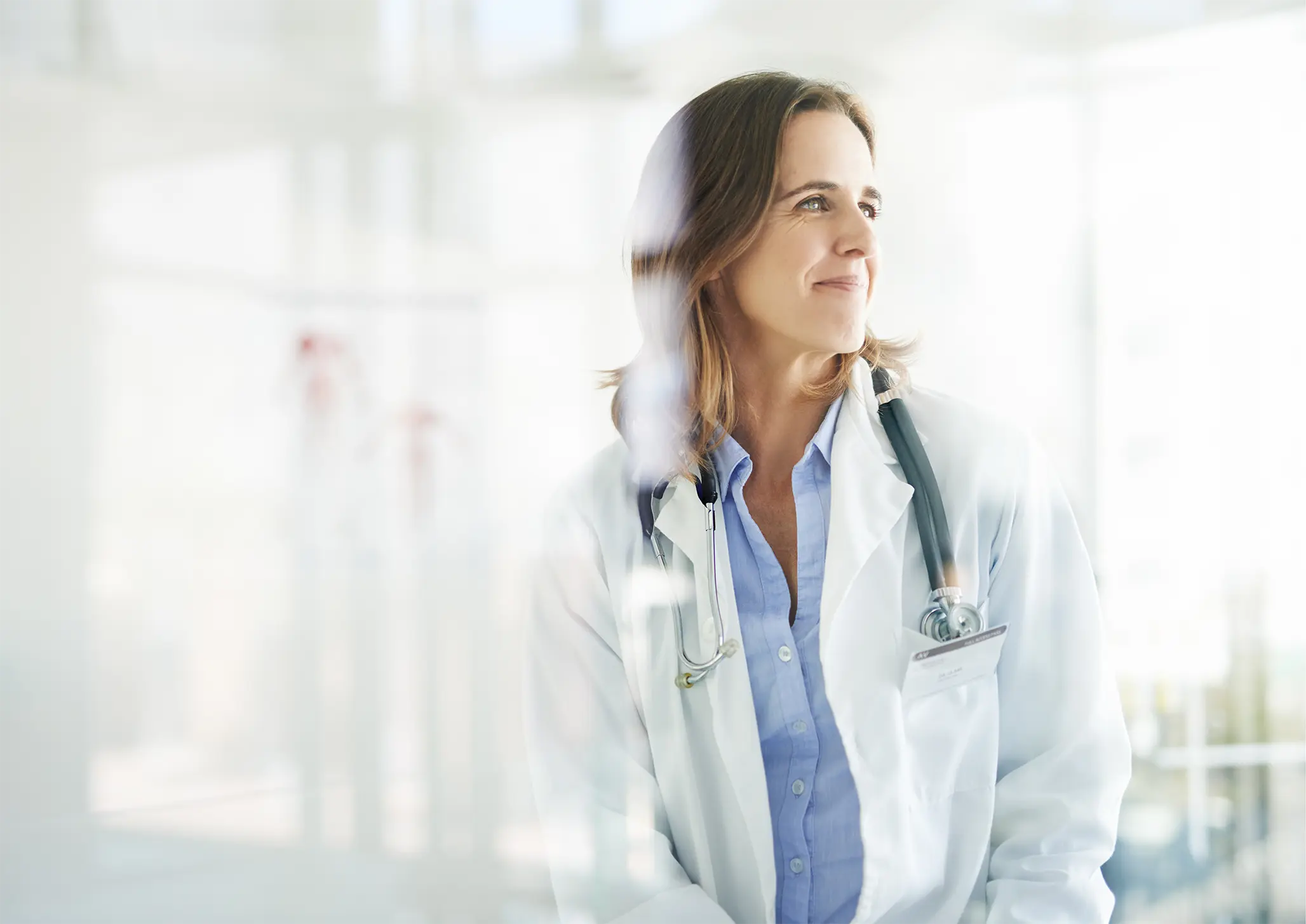 A confident healthcare professional looking ahead, symbolizing a clear path to better health.
